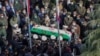 Military personnel carry the coffin of Mohsen Fakhrizadeh, an Iranian scientist killed on Friday, at a funeral ceremony in Tehran, Nov. 30, 2020.