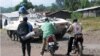 In this May 21, 2013 photo, a United Nations tank stands guard along a roadside near Goma, DRC.