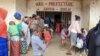 FILE - Refugees from the Central African Republic wait in line to be registered in Garoua-Boulai, Cameroon, Jan. 8, 2021. Cameroon has had an influx of street children in its largest cities, with some of them Central African Republic refugees. 