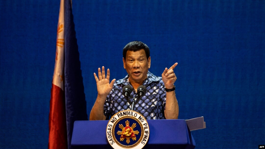 FILE - Philippine President Rodrigo Duterte gestures during the Partido Demokratiko Pilipino-LakasBayan (PDP-LABAN) meeting in Manila on May 11, 2019, ahead of Monday's the midterm elections.