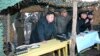 North Korean leader Kim Jong-Un (C) watches soldiers of the Korean People's Army (KPA) taking part in drills on March 25, 2013, in this picture released by the North's KCNA news agency.