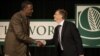 Microsoft founder Bill Gates greets Dr. Gebisa Ejeta, 2009 World Food Prize Laureate, left, before speaking at the World Food Prize symposium, Oct. 15, 2009, in Des Moines, Iowa.