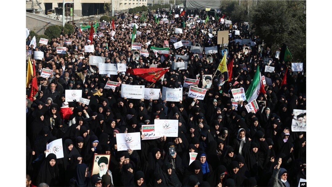 Iranian protesters chant slogans at a rally in Tehran, Iran, Dec. 30, 2017.