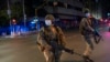 South African Defense Forces patrol downtown Johannesburg, South Africa, Friday, March 27, 2020. Police and army started patrolling moments after South Africa went into a nationwide lockdown for 21 days in an effort to mitigate the spread to the…