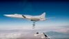 In this photo made from the footage taken from the Russian Defense Ministry official website on Nov. 26, 2017, Russian Tu-22M3 long-range bombers strike Islamic State targets in Syria.