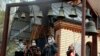 Women wearing face masks to protect against coronavirus ring the church bells at a memorial of the Chernobyl tragedy victims in capital Kyiv, Ukraine, April 26, 2020.