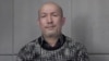 FILE - A man who identifies himself as Uighur poet and musician Abdurehim Heyit is seen in this still image taken from a video posted online by China Radio International's Turkish language service on Feb. 10, 2019.