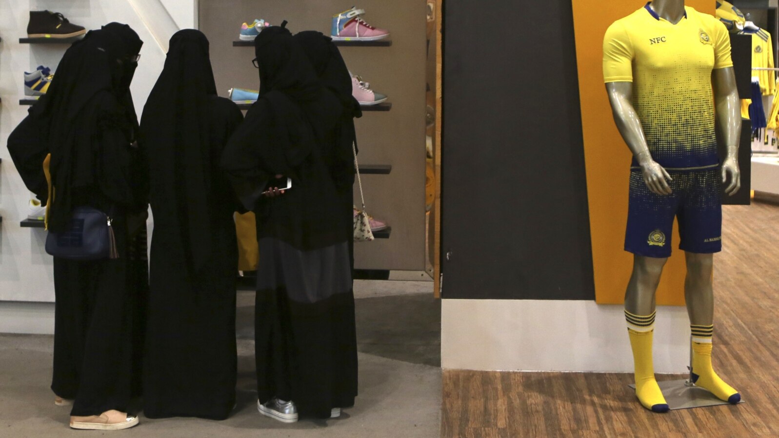 FILE - Saudi women shop at a mall in Riyadh, Saudi Arabia, Dec. 11, 2015. 