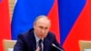 FILE - Russian President Vladimir Putin speaks as he chairs a meeting on drafting constitutional changes at the Novo-Ogaryovo residence outside Moscow, Jan. 16, 2020.