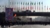 Smoke rises during a protest after authorities raised fuel prices, in the central city of Isfahan, Iran, Nov. 16, 2019.