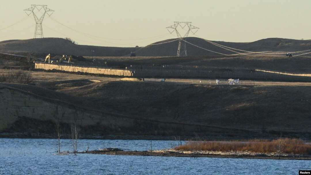 FILE - Dakota Access Pipeline equipment is seen near Lake Oahe, near the Standing Rock Indian Reservation, in this picture taken from across the Missouri River in Linton, North Dakota, Nov. 9, 2016.