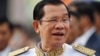 FILE - Cambodia's Prime Minister Hun Sen waits to attend Independence Day celebrations in Phnom Penh, Cambodia, Nov. 9, 2017.