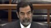 FILE - In this Dec. 6, 2006 file photo, former Iraq leader Saddam Hussein sits in court in Baghdad, Iraq, during the "Anfal" trial against him.