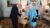 FILE - Britain's Queen Elizabeth II welcomes Boris Johnson, then newly-elected leader of the Conservative party, during an audience at Buckingham Palace, London, England, July 24, 2019.