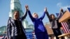 Democratic presidential candidate Hillary Clinton, center, celebrates at a rally with Rep. Karen Bass, D-Calif., left, and Rep. Maxine Waters, D-Calif., Monday, June 6, 2016.