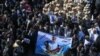 Iranian mourners gather during the final stage of funeral processions for slain top general Qassem Soleimani, in his hometown Kerman, Jan. 7, 2020.