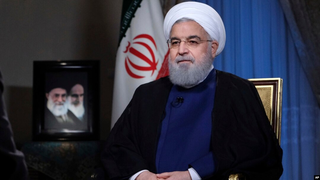 In this photo released by official website of the office of the Iranian Presidency, President Hassan Rouhani addresses the nation in a televised speech in Tehran, Aug. 6, 2018. 