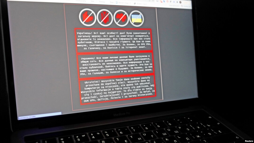 A laptop screen displays a warning message in Ukrainian, Russian and Polish, that appeared on the official website of the Ukrainian Foreign Ministry after a massive cyberattack, in this illustration taken Jan. 14, 2022. 