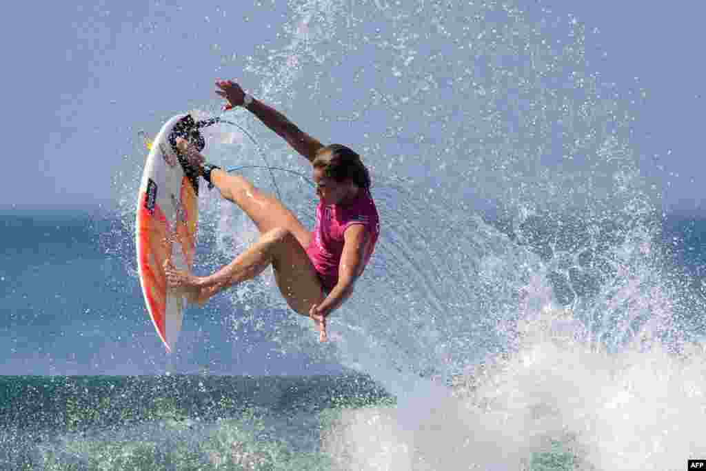 Courtney Conlogue of the U.S. performs a manuvre on a wave one day before the start of the World Surf League women's championship tour surfing event at Keramas in Gianyar on Indonesia's resort island of Bali.