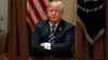 U.S. President Donald Trump waits for reporters to leave the room after speaking about his summit with Russia's President Putin during a meeting with members of the U.S. Congress at the White House in Washington, July 17, 2018. 