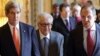 U.S. Secretary of State John Kerry (L), U.N.-Arab League envoy for Syria Lakhdar Brahimi (C) and Russia's Foreign Minister Sergei Lavrov (R) arrive at a news conference at the U.S. ambassador's residence in Paris, Jan. 13, 2014. 
