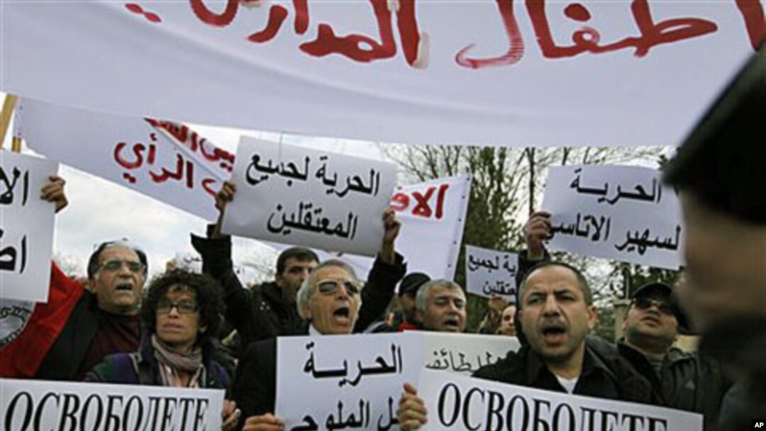 Syrian immigrants shout slogans in front of the Syrian embassy in Sofia, Bulgaria, to protest Syrian president Bashar al-Assad after violence was used on a group of anti-governmental protesters who allegedly were tortured and held hostage in Syria, March 