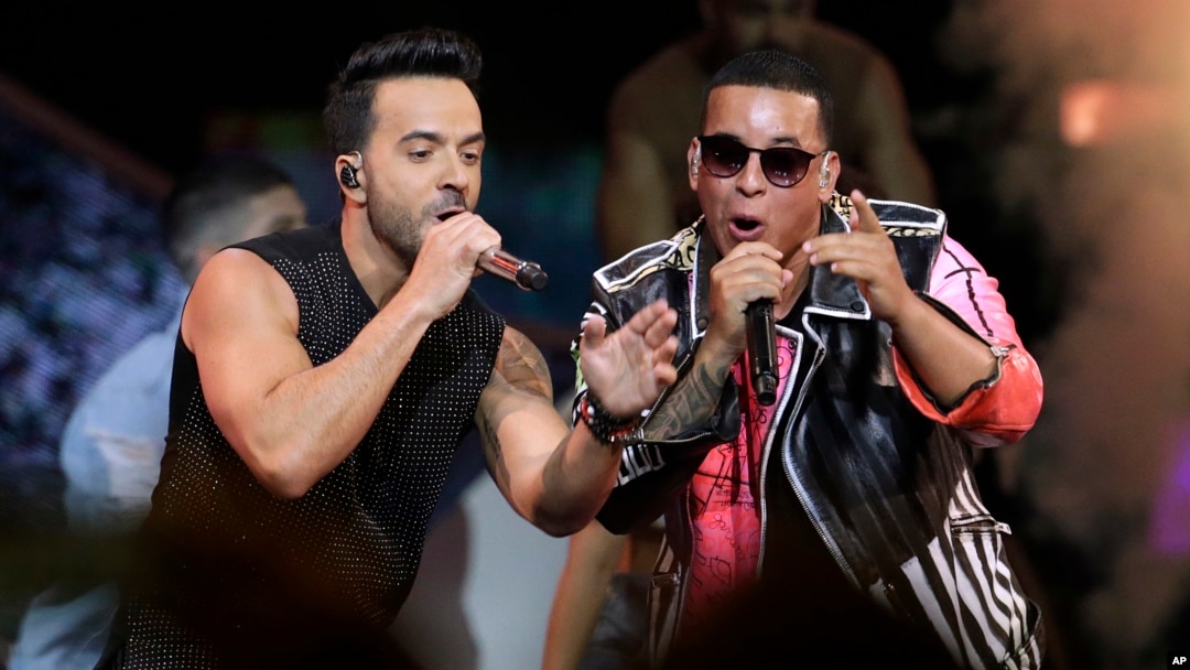FILE - singers Luis Fonsi, left and Daddy Yankee perform during the Latin Billboard Awards in Coral Gables, Fla.