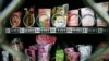FILE - Condoms are seen above chewing gum and food snacks in a vending machine in China, Sept. 23, 2007. State law limits what Yale University in Connecticut can dispense in its campus vending machines.