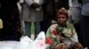 (ፎቶ ፋይል፡ ወላይታ ውስጥ በ2008 በቀይ መስቀል የሚሰጥ እርዳታ እየተቀበሉ)