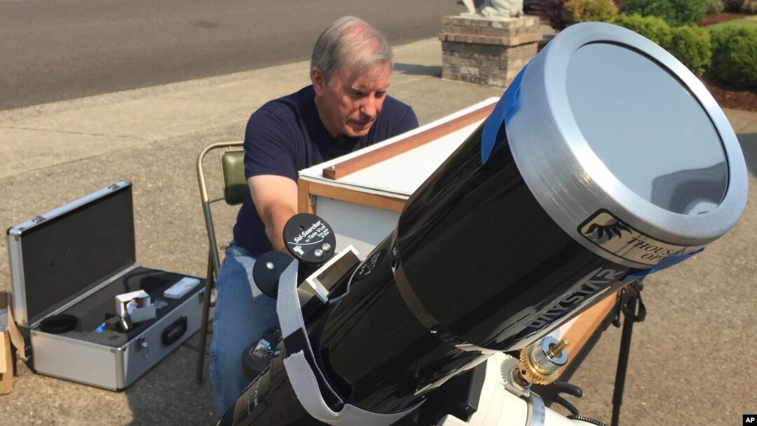 Amateur astronomer Mike Conley practices, Aug. 3, 2017, with the telescope he will use to document the Aug. 21 total solar eclipse, at his home in Salem, Oregon.