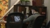 An activist is seen working on his computer at the office of pro-Kremlin youth group SET (Network). (VOA video screengrab)