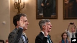 Career Foreign Service officer George Kent, left, and top U.S. diplomat in Ukraine William Taylor, right, are sworn in to testify before the House Intelligence Committee on Capitol Hill in Washington, Nov. 13, 2019.