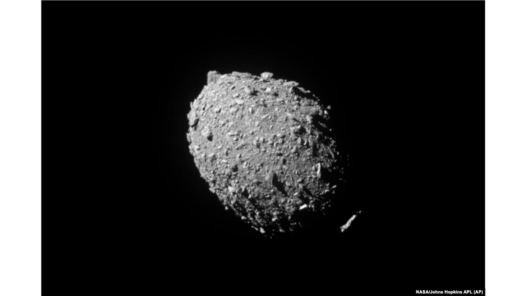 FILE - This image provided by NASA shows the asteroid Dimorphos, captured by NASA’s DART mission just two seconds before the spacecraft struck its surface, Sept. 26, 2022.