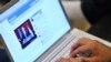 FILE - An Internet user in Los Angeles monitors a Facebook discussion board while watching televised coverage of President Barack Obama's speech from Cairo University, June 4, 2009.