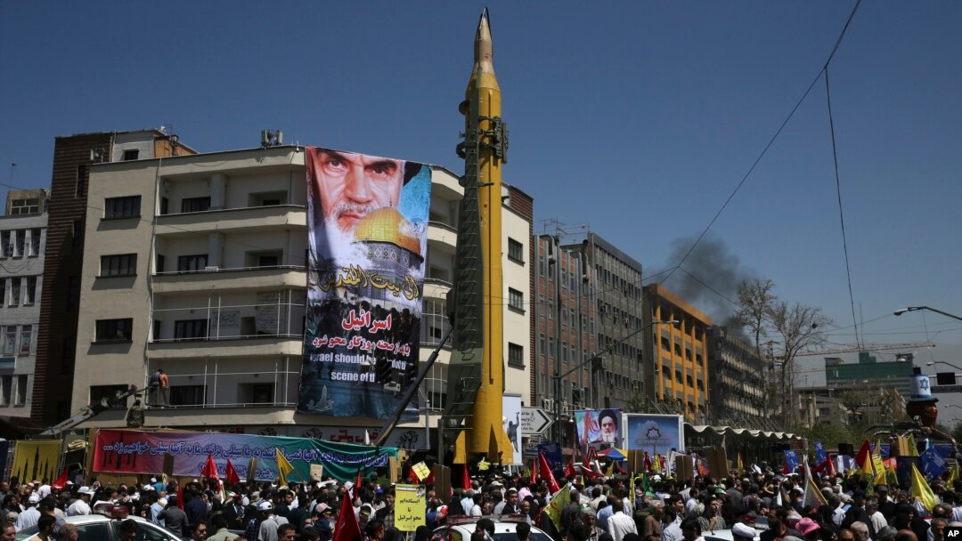 FILE - A ballistic missile is displayed by Iran's Revolutionary Guard at a pro-Palestinian rally marking Al-Quds (Jerusalem) Day, in Tehran, Iran, June 23, 2017.