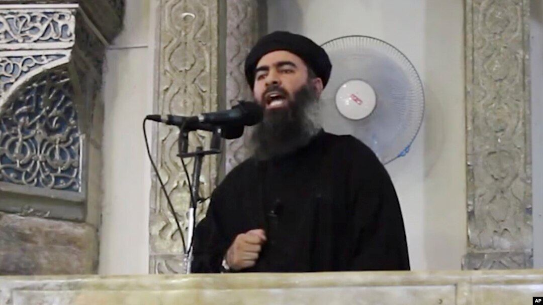 FILE - An image made from video posted on a militant website July 5, 2014, purports to show the leader of the Islamic State group, Abu Bakr al-Baghdadi delivering a sermon.