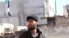 Eyad Aljarod stands on a rooftop after covering an anti-government demonstration in Saraqib, Syria, Dec. 29, 2012. (Courtesy photo)