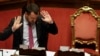 FILE - Italian Deputy Premier and Interior Minister, Matteo Salvini, gestures as he addresses the Senate in Rome, July 11, 2019.
