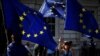 Anti-Brexit protesters wave European Union flags outside the Cabinet Office in London, Aug. 30, 2019. 