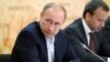 FILE - Russian President Vladimir Putin attends a meeting on agriculture while visiting farms in Rostov region, Russia, Sept. 24, 2015.
