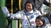 FILE - U.S. astronaut Jack Fischer, above, and Russian cosmonaut Fyodor Yurchikhin, crew members of the mission to the International Space Station, wave near the rocket prior launch at the Russian-leased Baikonur cosmodrome, Kazakhstan, April 20, 2017. 