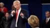 Republican presidential nominee Donald Trump points at Democratic presidential nominee Hillary Clinton as he speaks during the second presidential debate at Washington University in St. Louis, Oct. 9, 2016.