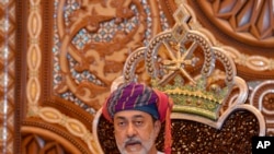 In this photo made available by Oman News Agency, Oman's new sultan Haitham bin Tariq Al Said, makes his first speech after swearing in at the Royal Family Council in Muscat, Oman,vJan. 11, 2020.