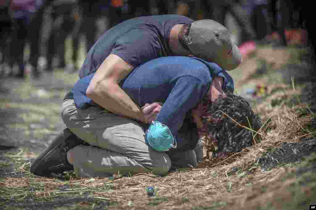 Relatives react at the scene where the Ethiopian Airlines Boeing 737 Max 8 crashed shortly after takeoff on Sunday killing all 157 on board, near Bishoftu, south of Addis Ababa, in Ethiopia.