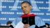 President Barack Obama reads over a program before delivering the commence address at Barnard College, NY, May 14, 2012.