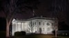 FILE - In this photo, a light rain falls outside the White House in Washington, Jan. 28, 2022. 