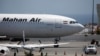 FILE - A Mahan Air airplane is seen at Simon Bolivar International Airport outside Caracas, Venezuela, April 8, 2019.