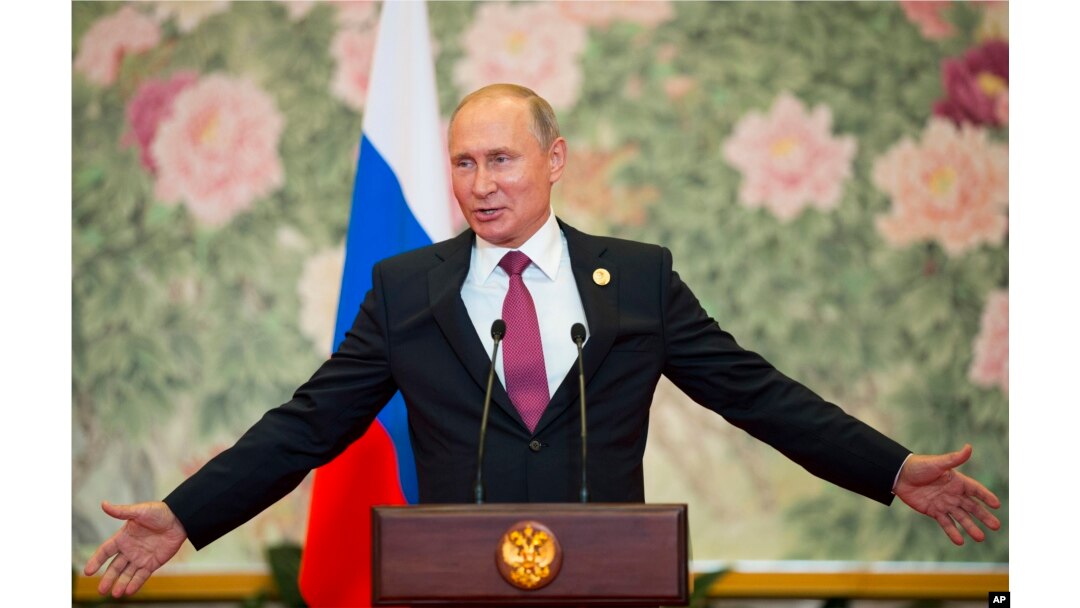Russian President Vladimir Putin speaks during a news conference after the Shanghai Cooperation Organization (SCO) Summit in Qingdao in eastern China's Shandong Province, June 10, 2018.