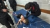 A wounded Palestinian girl is assisted as she lies on a bed at Kamal Adwan Hospital, during the ongoing Israeli military operation, amid the Israel-Hamas conflict, in Beit Lahiya, in the northern Gaza Strip, Dec. 17, 2024. 