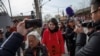 FILE - Li Wenzu, wife of detained Chinese rights lawyer Wang Quanzhang, is followed by friends and media near a Supreme People's Court complaints office in Beijing, China, April 4, 2018. 